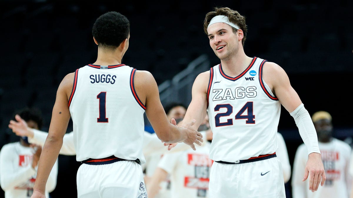 Jalen Suggs and Corey Kispert of the Gonzaga Bulldogs react after a play in the second half against the Norfolk State Spartans in the first round game of the 2021 NCAA Men's Basketball Tournament at Bankers Life Fieldhouse.