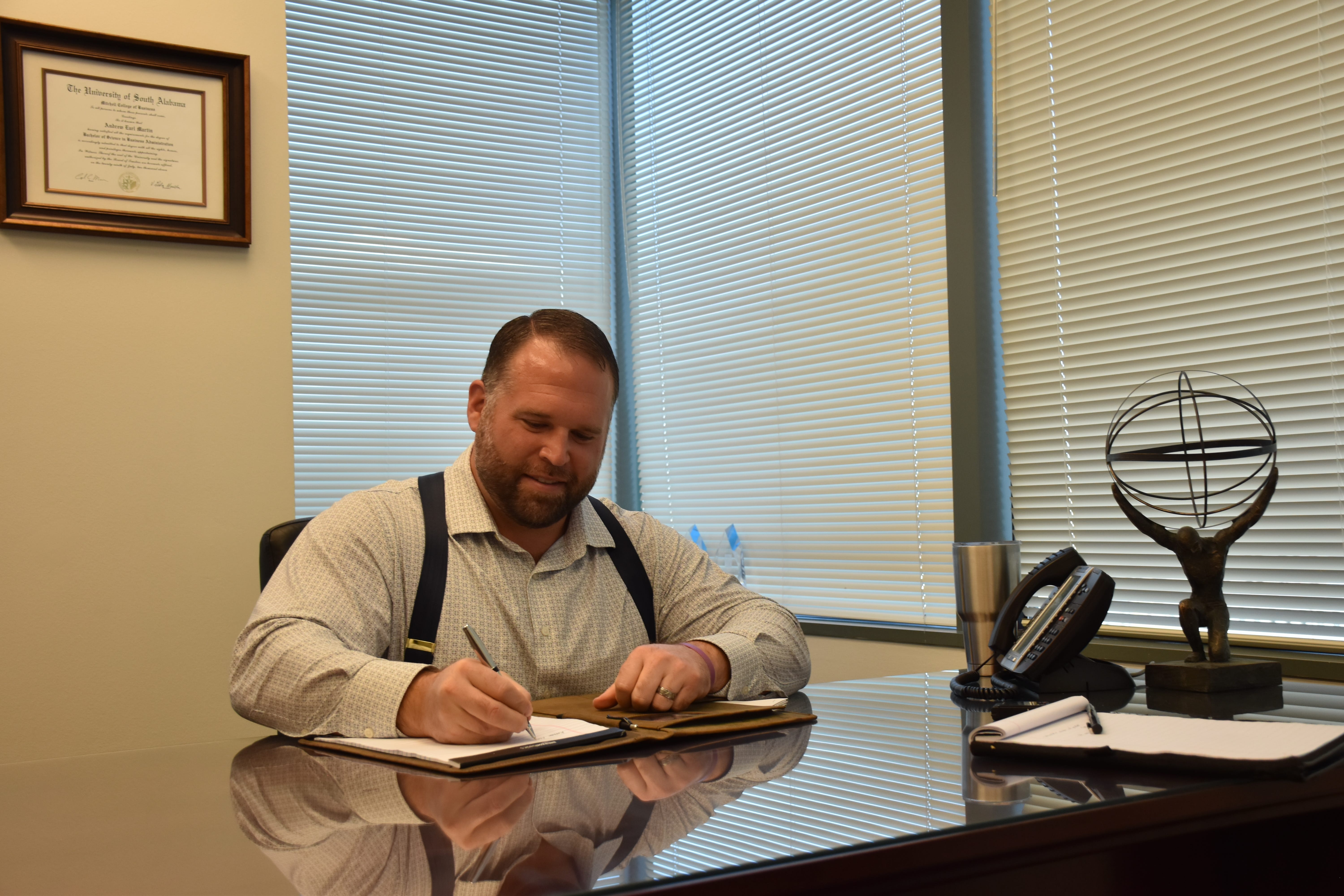 Andrew Martin, founder and president of Atlas Financial Strategies, smiles Monday while discussing his decision to pay for six catalytic converters stolen from the nonprofit Santa Rosa Transportation.