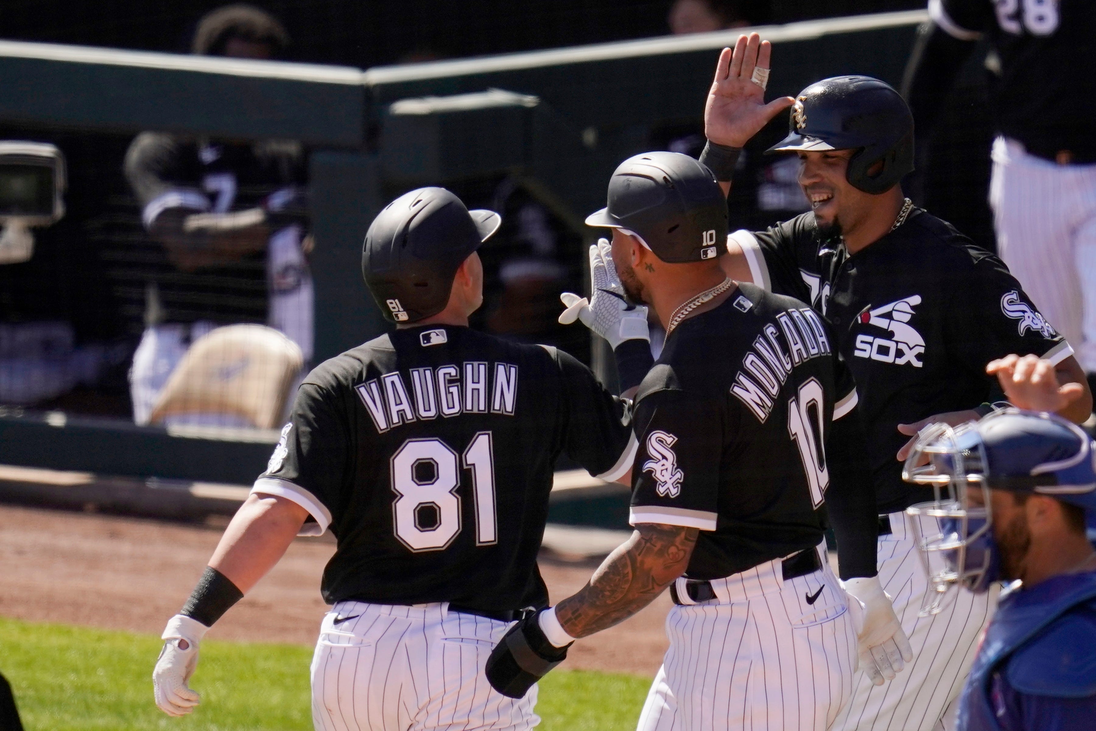 Vaughn celebrates a spring training home run with Yoan Moncada and Jose Abreu.