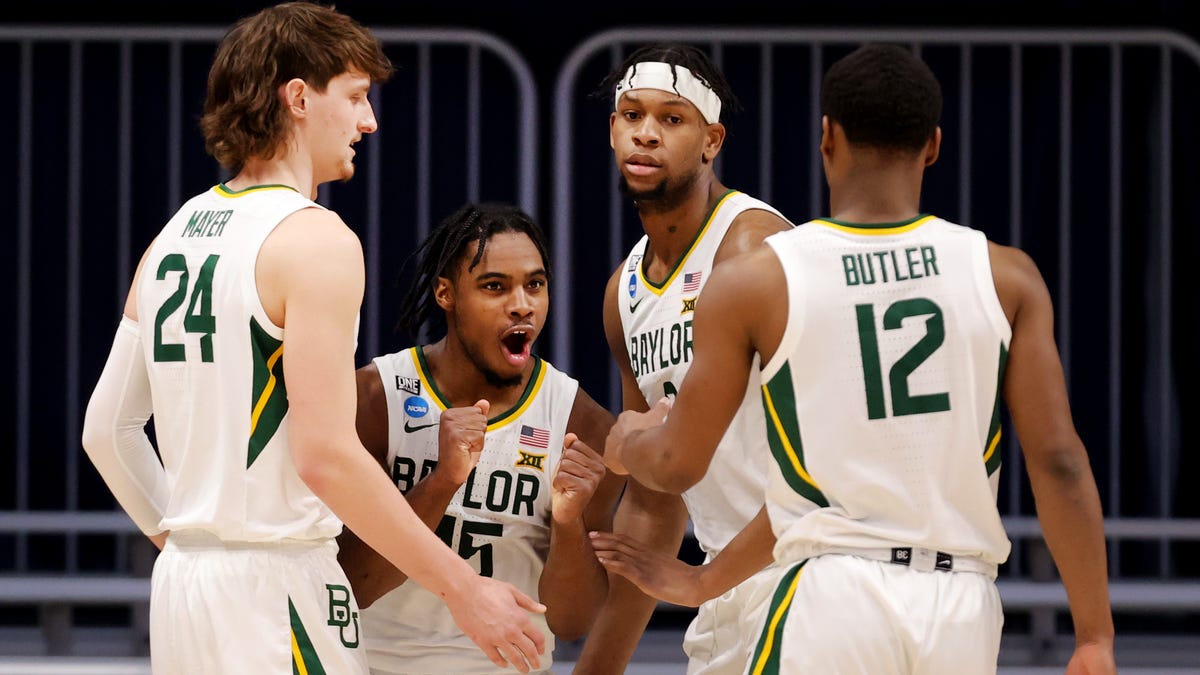 Davion Mitchell of the Baylor Bears reacts with his teammates during the first half against the Wisconsin Badgers in the second round game of the 2021 NCAA Men's Basketball Tournament at Hinkle Fieldhouse on March 21, 2021 in Indianapolis, Indiana.