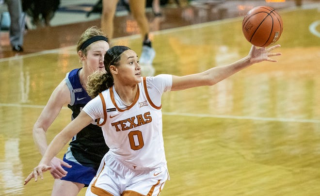 Texas guard Celeste Taylor, shown making a steal as Kansas State's Laura Macke looks on during their game in Austin on Feb. 21, leads the Longhorns in steals this season.