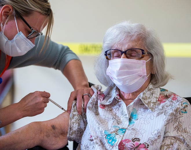 Arevella Boudreau, a resident of Grundy Tower in the Bristol borough, will receive his first Pfizer vaccine from Ashley Hughes, RN, of Warrington on Tuesday March 23, 2021.
