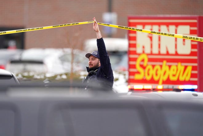 Police work on the scene outside a King Soopers grocery store where a shooting took place Monday, March 22, 2021, in Boulder, Colo. (AP Photo/David Zalubowski)