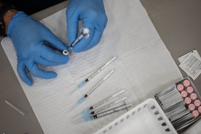 Syringes are prepared in advance at the state-run COVID-19 vaccination site at the SUNY Potsdam campus in St. Lawrence County on Thursday, March 11, 2021.