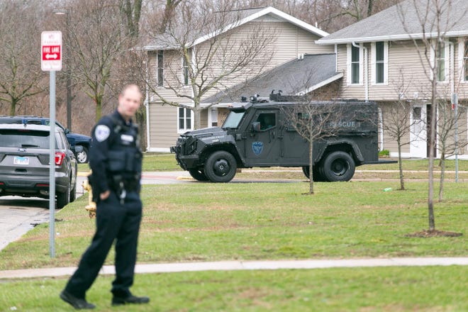 Rockford police investigate at Orton Keyes apartment complex Wednesday, March 24, 2021, in Rockford, where a barricaded man was wanted in connection with several warrants. At one point the man climbed on the roof of a residence. The man surrendered to police after about two hours.