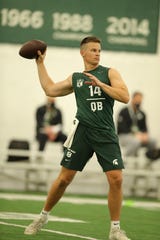 Brian Lewerke goes through drills during Michigan State football's pro day March 24, 2021.