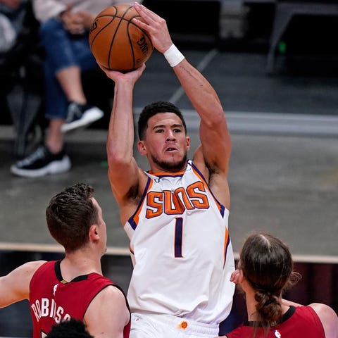 Devin Booker (1) is averaging 25.1 points per game