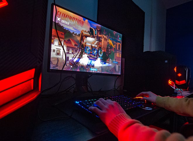 Ari Evans, of Ambler, plays Overwatch at Metro Esports in Warminster. Overwatch is just one of the games that Holy Family University esports athletes will be able to play as part of the new team.