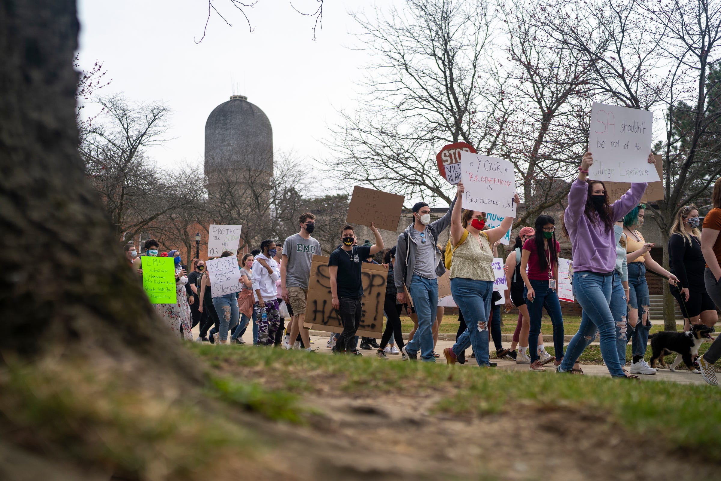 Protestors walk through campus during a march supporting sexual assault survivors in response to recent news of 11 women who filed a lawsuit against EMU at Eastern Michigan University on Thursday, March 25, 2021, in Ypsilanti. A Title IX lawsuit was filed Wednesday against the Eastern Michigan University Board of Regents and two fraternities, saying they covered up and failed to adequately address sexual assaults by several male students, according to previous Free Press reporting.