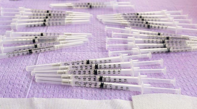Syringes filled with the single-dose Johnson & Johnson Janssen Covid-19 vaccine await distribution.