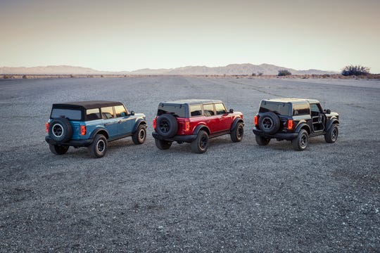 Comparison lineup of the three different tops available on Ford Motor Co.'s forthcoming full-size Bronco SUV. The Modular Painted Hardtop will be available in the 2022 model year.