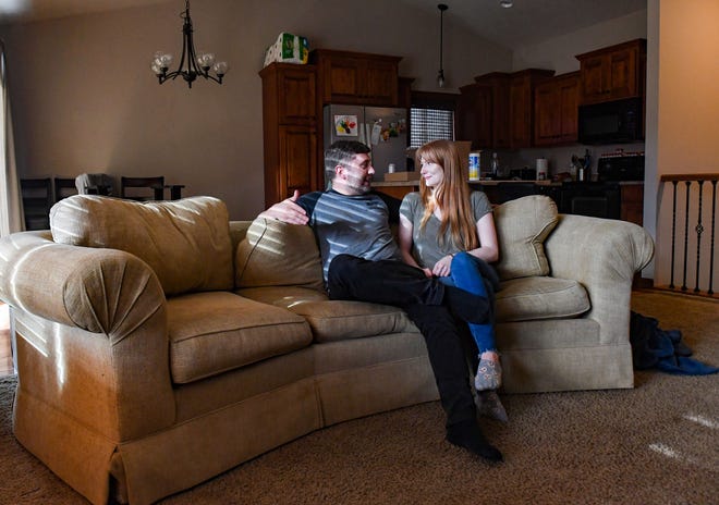 Katie Seeman and Joel Svendsen sit on the couch in their new rental home on Thursday, March 25, 2021 in Sioux Falls.