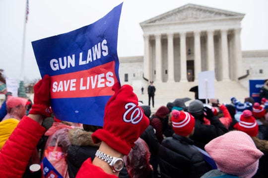 Supporters of gun control and firearm safety measures hold a protest rally outside the Supreme Court as the court hears oral arguments in State Rifle and Pistol v. City of New York, NY, in Washington, D.C., on December 2, 2019.
