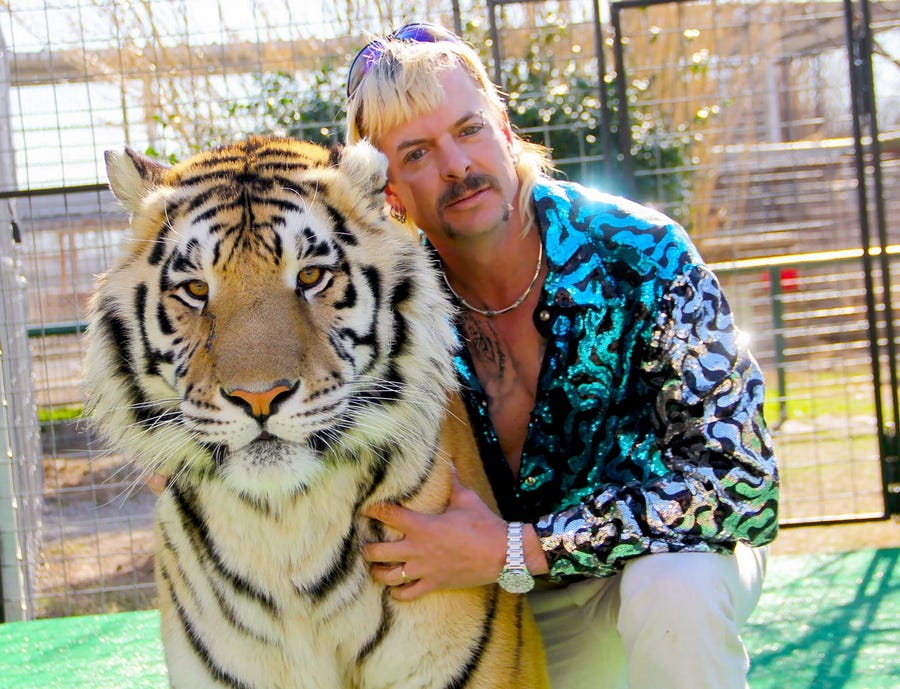 The Tiger King Joseph "Joe Exotic" Maldonado-Passage with one of his tigers.