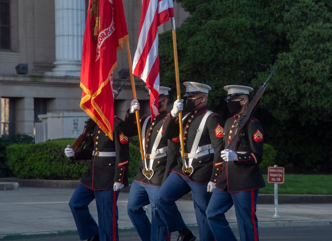 An honor guard from the 4th Marine Logistics Group out of Lathrop post the colors during the National Medal of Honor Day observance in front of City Hall in downtown Stockton. The ceremony, put on by the Stockton Marine Corps Club, honored Richard A. Pittman, a U.S. Marine who received the Medal of Honor for his heroic actions on July 24, 1966, during the Vietnam War.