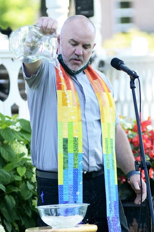 Rev. Ryan Donahoe of the First Presbyterian Church of Petoskey introduces an interfaith prayer service in August in Petoskey’s Pennsylvania Park.