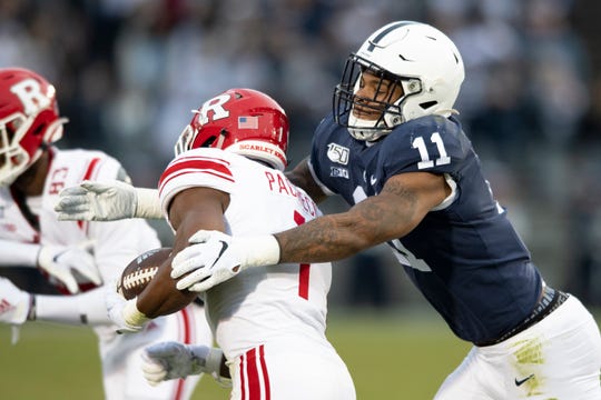FILE - In this Nov. 30, 2019, file photo, Penn State linebacker Micah Parsons (11) tackles Rutgers tight end Johnathan Lewis (11) in the first quarter of an NCAA college football game, in State College, Pa. Parsons was selected to The Associated Press preseason All-America first-team, Tuesday, Aug. 25, 2020. Parsons and Oregon tackle Penei Sewell are among 11 players selected who are not slated to play this fall. (AP Photo/Barry Reeger, File)