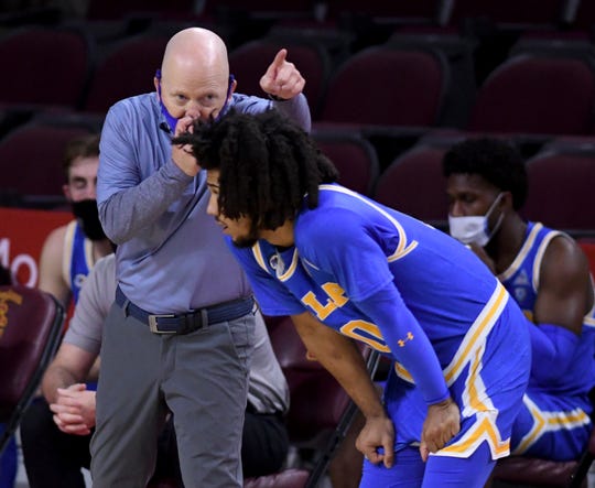 UCLA coach Mick Cronin, seen here with Tyger Campbell, has the Bruins on the brink of the Elite Eight.