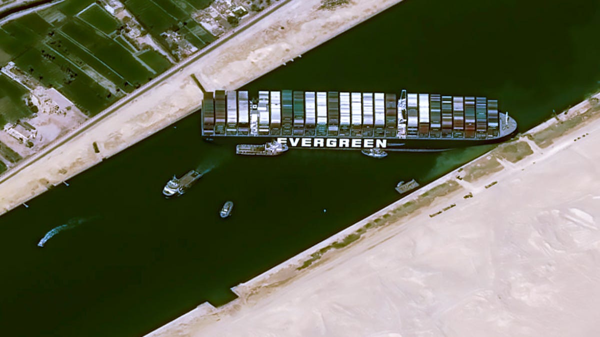 This satellite image from Cnes2021, Distribution Airbus DS, shows the cargo ship MV Ever Given stuck in the Suez Canal near Suez, Egypt, March 25, 2021. The skyscraper-sized cargo ship wedged across Egypt's Suez Canal further imperiled global shipping Thursday as at least 150 other vessels needing to pass through the crucial waterway idled waiting for the obstruction to clear, authorities said.