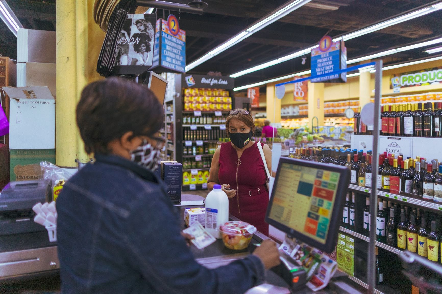 Elsa Romero purchases a vanilla poundcake, fruit and milk at a discount grocer March 16 in Miami. For Romero, 57, the cake is a cheap alternative to her expensive insulin.