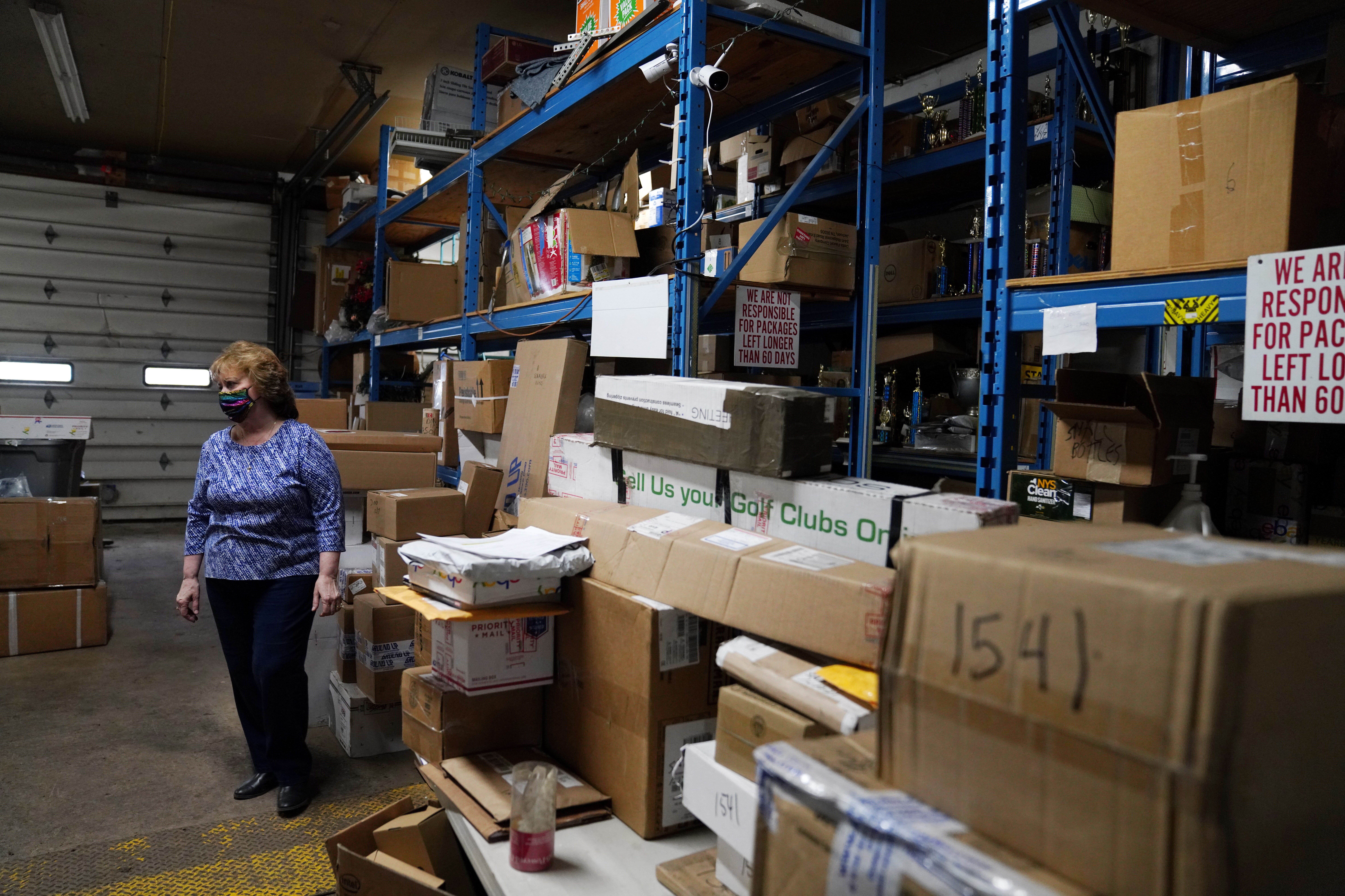 Laurel Roethel's mailing center in Ogdensburg is full to the brim with packages that haven't been claimed by Canadian customers because of the border closure, which has hampered Ogdensburg's economy.