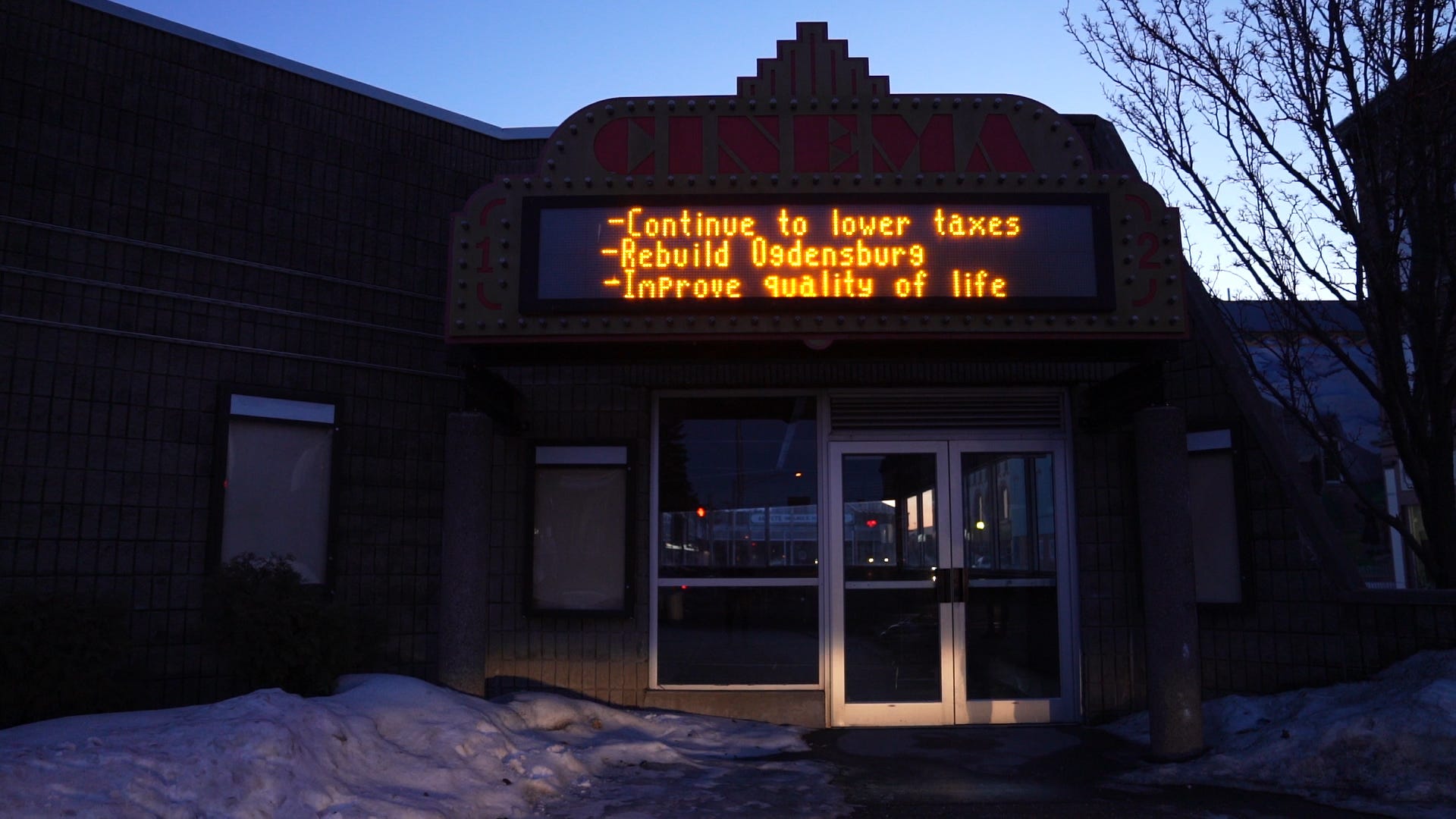 Ogdensburg's shuttered cinema, owned by the city's mayor, displays political messages on its marquee.