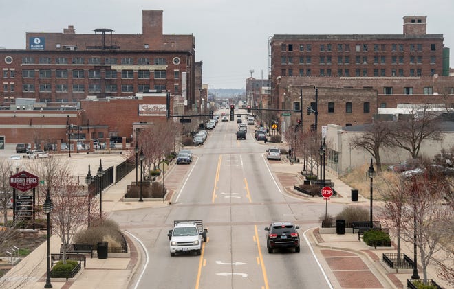 A view down Southwest Washington Street shows some of the old warehouses and buildings that have been renovated or are undergoing renovation in Peoria’s Warehouse District.