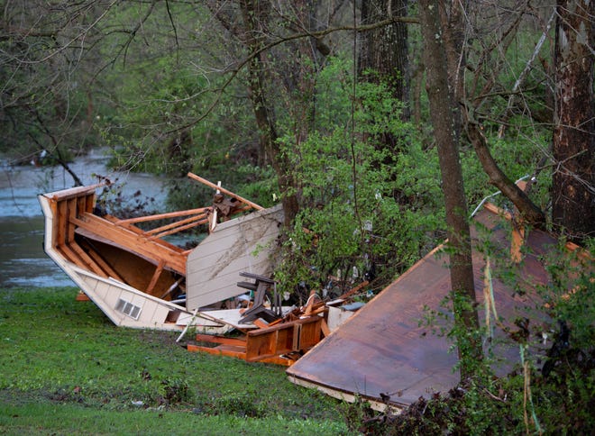 Debris lies along the bank of the Sevenmile creek near Edmondson Pike Sunday, March 28, 2021 in Nashville, Tenn. Flash flooding along Sevenmile Creek the night before caused major damage in the South Nashville neighborhood. 