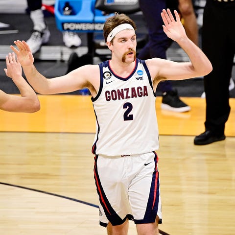 Gonzaga forward Drew Timme high-fives guards Andre