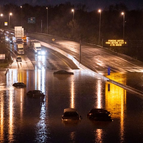 Cars are seen submerged on I-24 near Antioch Pike 