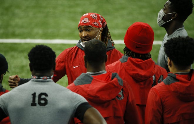 Ohio State Buckeyes cornerback Shaun Wade (24) speaks to teammates before the start of the Big Ten Championship football game between the Ohio State Buckeyes and the Northwestern Wildcats on Saturday, Dec. 19, 2020 at Lucas Oil Stadium in Indianapolis.