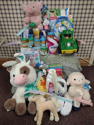 The FCFB Ag. Week baby basket held over two dozen baby items and products made from or representing agricultural commodities. Each item was tagged with an agriculture fact emphasizing the importance of Fulton County and American Agriculture.