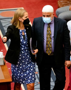 Imad Enchassi, senior imam of the Islamic Society of Greater Oklahoma City, walks with Sen. Carri Hicks before giving the daily prayer Monday in the Oklahoma state Senate. Enchassi is likely the first imam (Muslim faith leader) to offer a prayer on the Oklahoma Senate Floor.