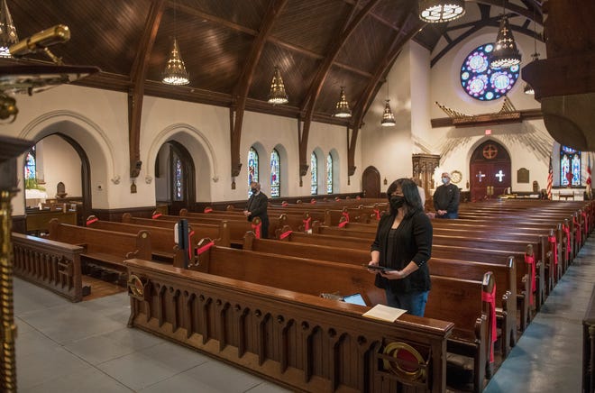 Parishioners of the Christ Church in Bordentown keep their distance from one another as they attend a Low Mass for Holy Monday on March 29, 2021.  The church is able to celebrate Holy Week and Easter indoors this year after being closed for indoor services due to the COVID pandemic.  