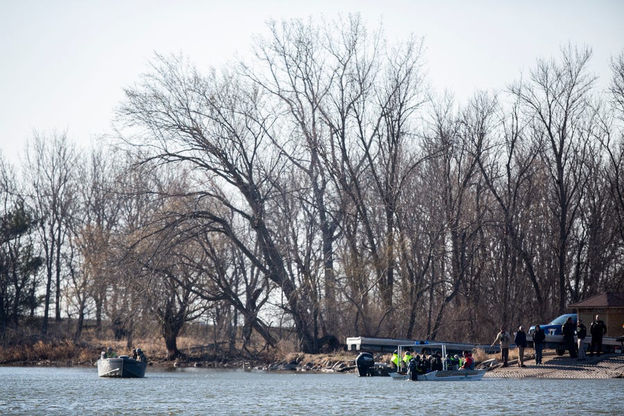 Law enforcement officers search for an Iowa State University Crew Club member on March 29 at Little Wall Lake in Hamilton County.