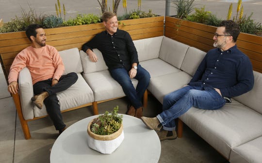Nick Arambula (L-R), Chris Lee and Mike Fretto pose for pictures at Neighbor, a Phoenix-based outdoor furniture store, in downtown Phoenix.