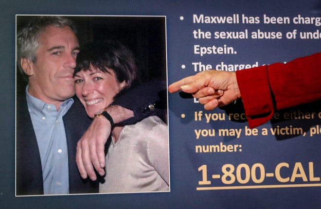 Audrey Strauss, acting U.S. Attorney for the Southern District of New York, points to a photo of Jeffrey Epstein and Ghislaine Maxwell during a press conference in New York.