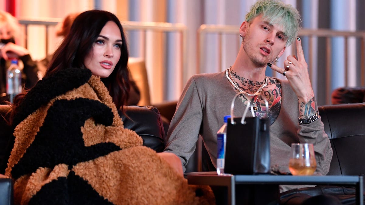 Machine Gun Kelly and Megan Fox are seen in attendance during the UFC 260 event at UFC APEX on March 27, 2021 in Las Vegas.