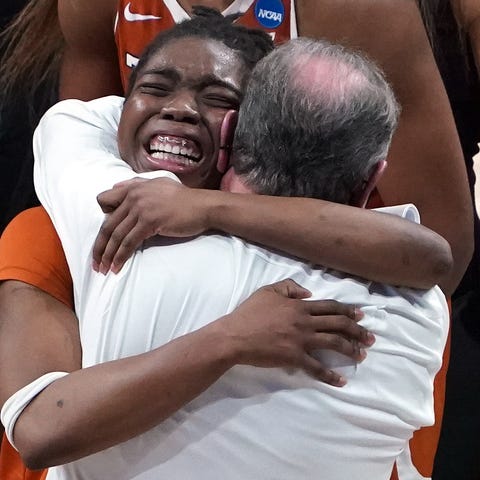 Texas guard Joanne Allen-Taylor embraces coach Vic