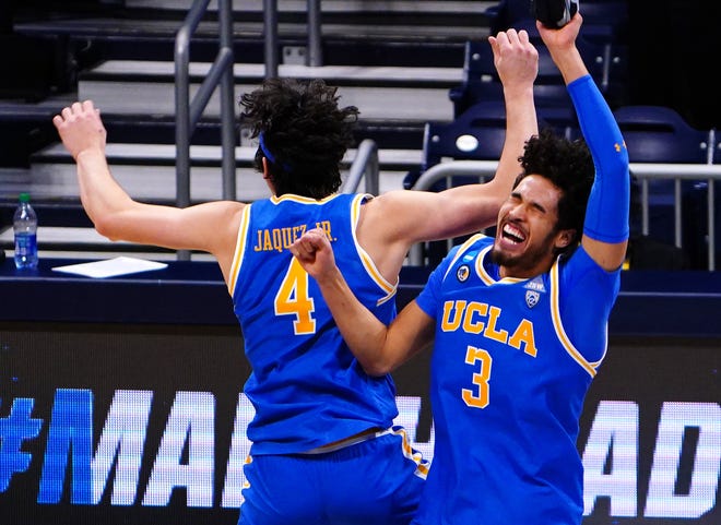 UCLA's Jaime Jaquez Jr. (4) and Johnny Juzang celebrate their Sweet 16 win over Alabama.