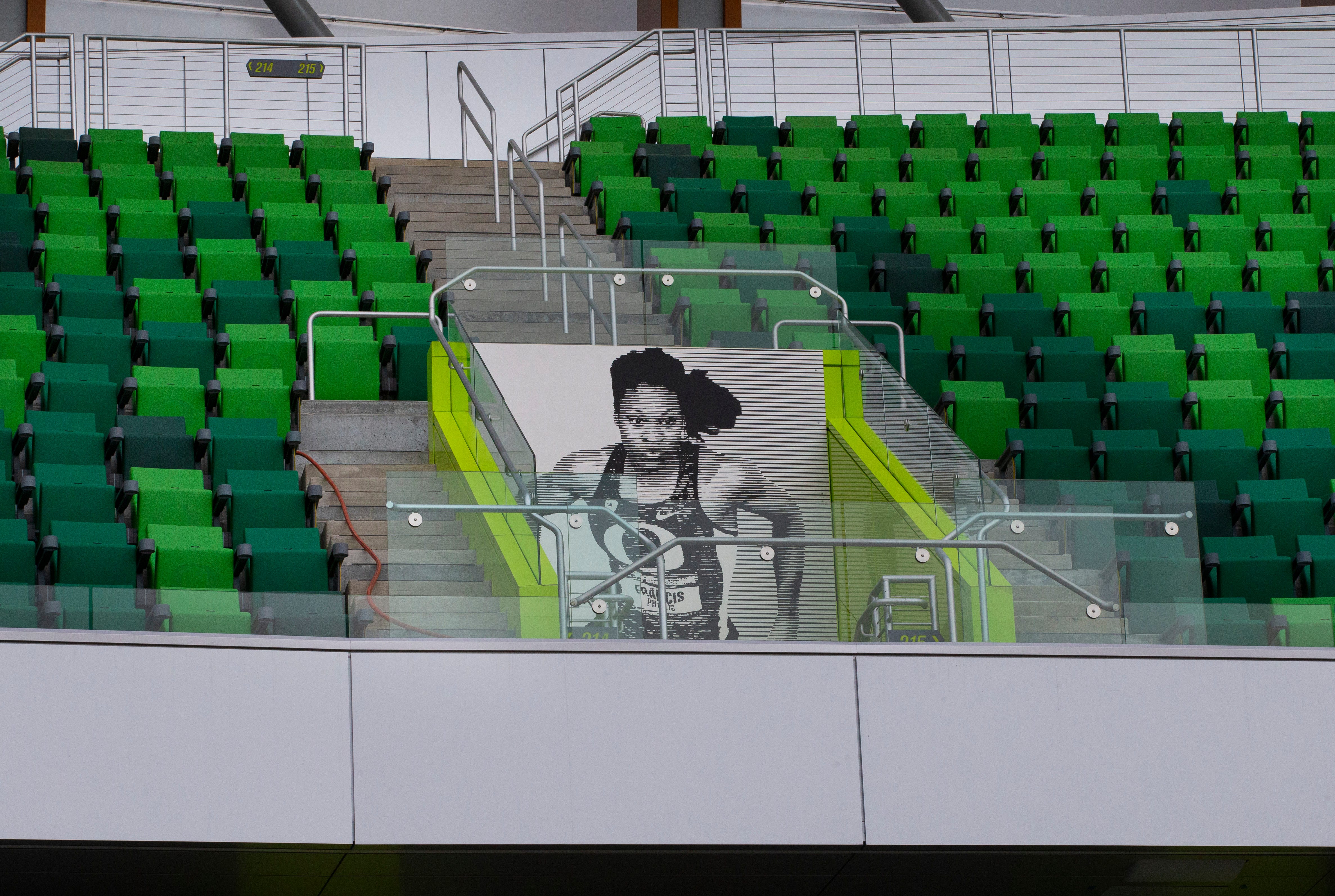 A photograph of Phyllis Francis, University of Oregon class of 2014 and winner of gold medals in the 400 meters and 4×400 meter relay events at the 2017 World Championships, is one of many Oregon athletes from the past who’s image mark the exits of Hayward Field  at the University of Oregon in Eugene, Oregon, on March 29, 2021.
