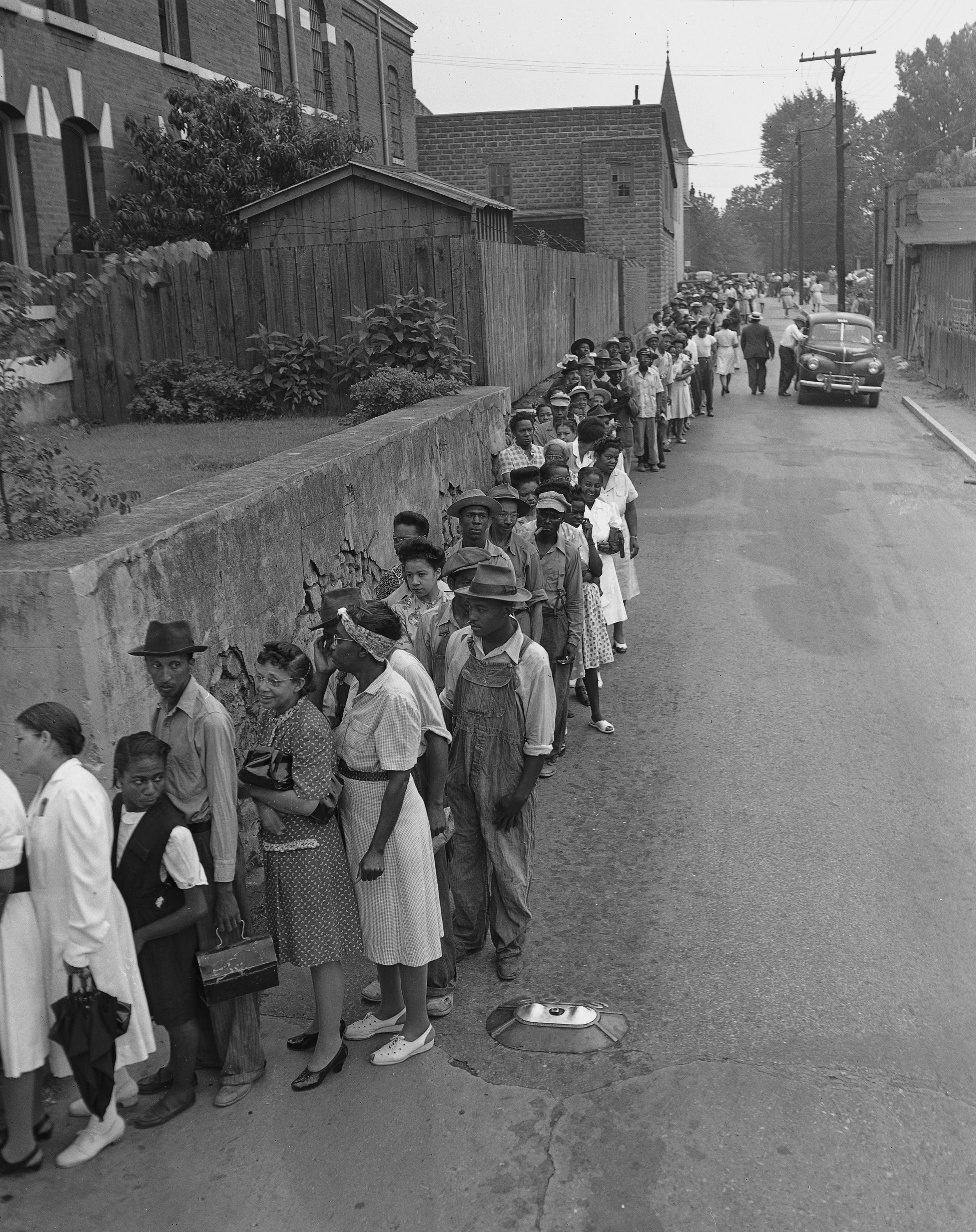 A line of Black voters, over two blocks long, await their chance to get to the polls before 8 o'clock, July 17, 1946, in Marietta, Ga. as voting in Georgia's primary got underway. In other places around Georgia, Black and white people voted together. (AP Photo)