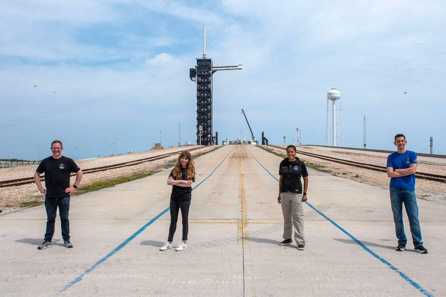 Inspiration 4 crew members Chris Sembroski, Hayley Arceneaux, Sian Proctor, and Jared Isaacman are seen at Kennedy Space Center's pad 39A. Their three-day, all-civilian mission to low-Earth orbit is targeting no earlier than September.