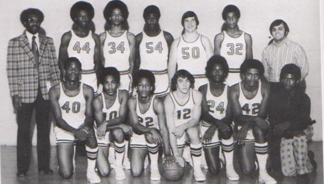 Mike Woodson (No. 44) stands with his Broad Ripple High School team. Coach Bill Smith stands to his left.