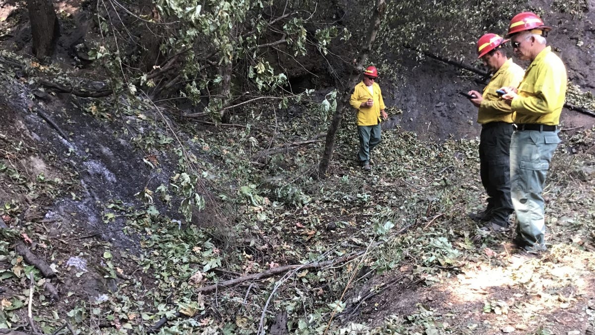 National Park Service investigators collect data from the 2018 Carr Fire. The park service released the findings of the 2018 Carr Fire investigation in a approximately 2,500-page report on Tuesday, March 30, 2021.