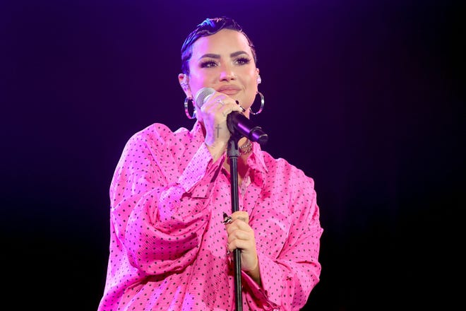 Demi Lovato performing at the drive-in premiere of docuseries "Dancing with the Devil" in Beverly Hills, California, last month.