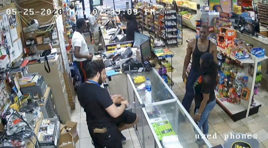 Police were called after George Floyd, right, was accused of trying to pass counterfeit money inside the Cup Foods store  May 25, 2020, in Minneapolis.