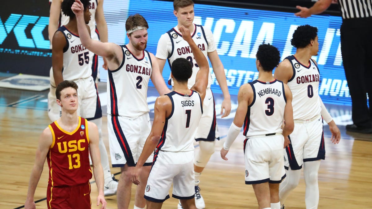 Gonzaga Bulldogs celebrate after the game in the Elite Eight of the 2021 NCAA Tournament against the Southern California Trojans at Lucas Oil Stadium.