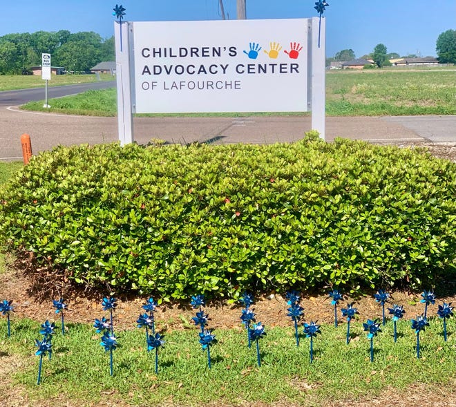 Members of the Lafourche Parish District Attorney’s Office placed blue pinwheels in the grass of the Children’s Advocacy Center Thursday morning to mark the beginning of National Child Abuse Prevention Month.