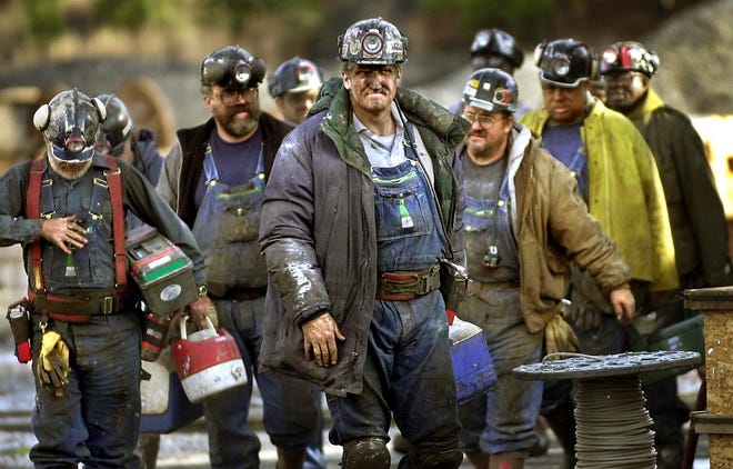 Coal miners in Brookwood leave the No. 5 mine following a shift in 2002. [Staff file photo/Jason Getz]
